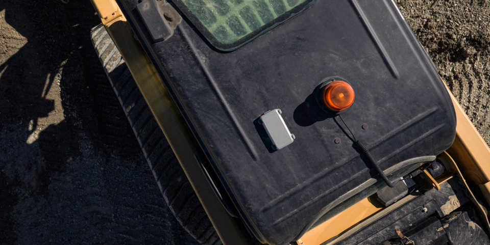 AssetHawk satellite tracker on top of a dump truck